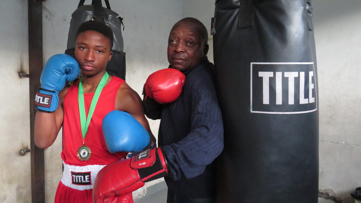 Lehlohonolo "Hands of Stone" Motsi, with trainer-cum-manager David Molatlhoe of the Devil's Boxing Club.