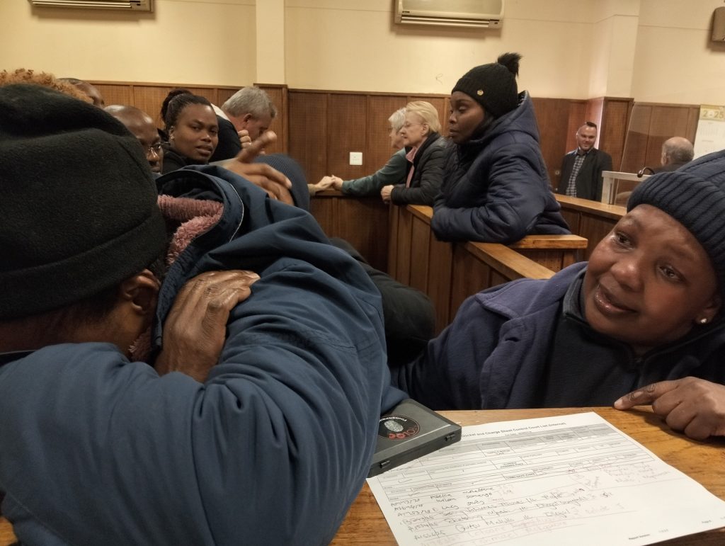 Emotional scene played out in court when the accused and their families were briefly allowed contact