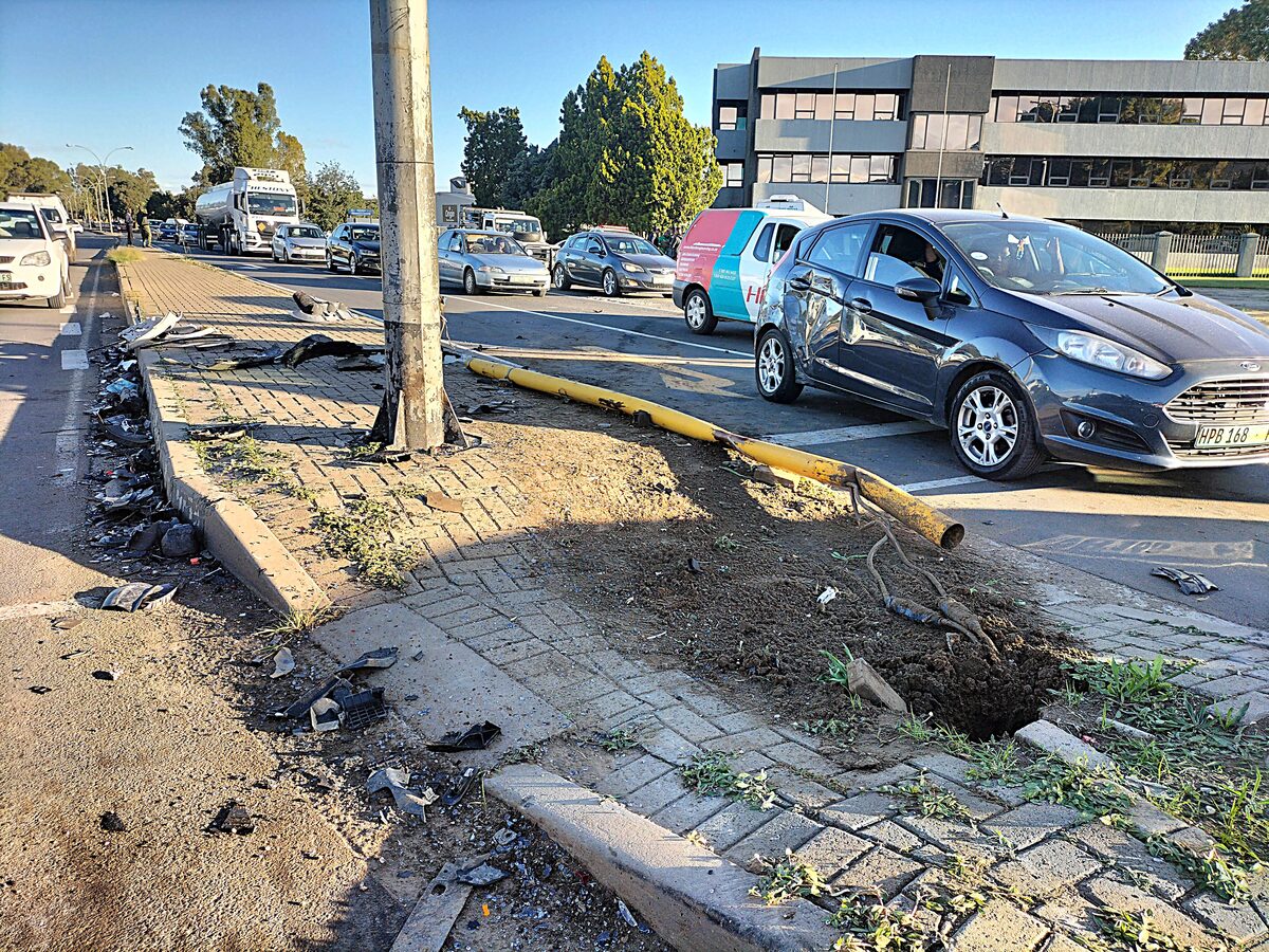 The trail of damage to traffic lights and a third private vehicle attests to the impact of the collision.