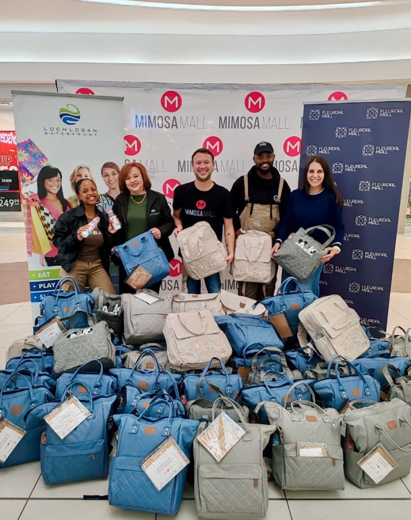 The 100 newborn care bags packed by staff from four Bloemfontein shopping centres.