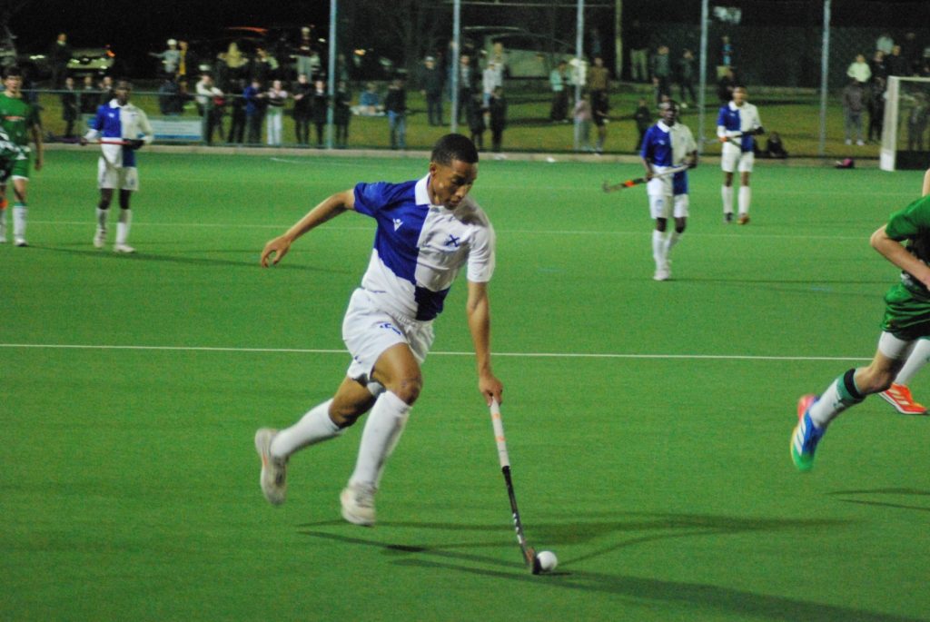 Kaden Henderson with the ball in the league final between St Andrew's and Jim Fouché. 