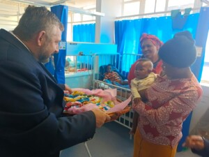 Handing out Easter Eggs to babies in hospital
