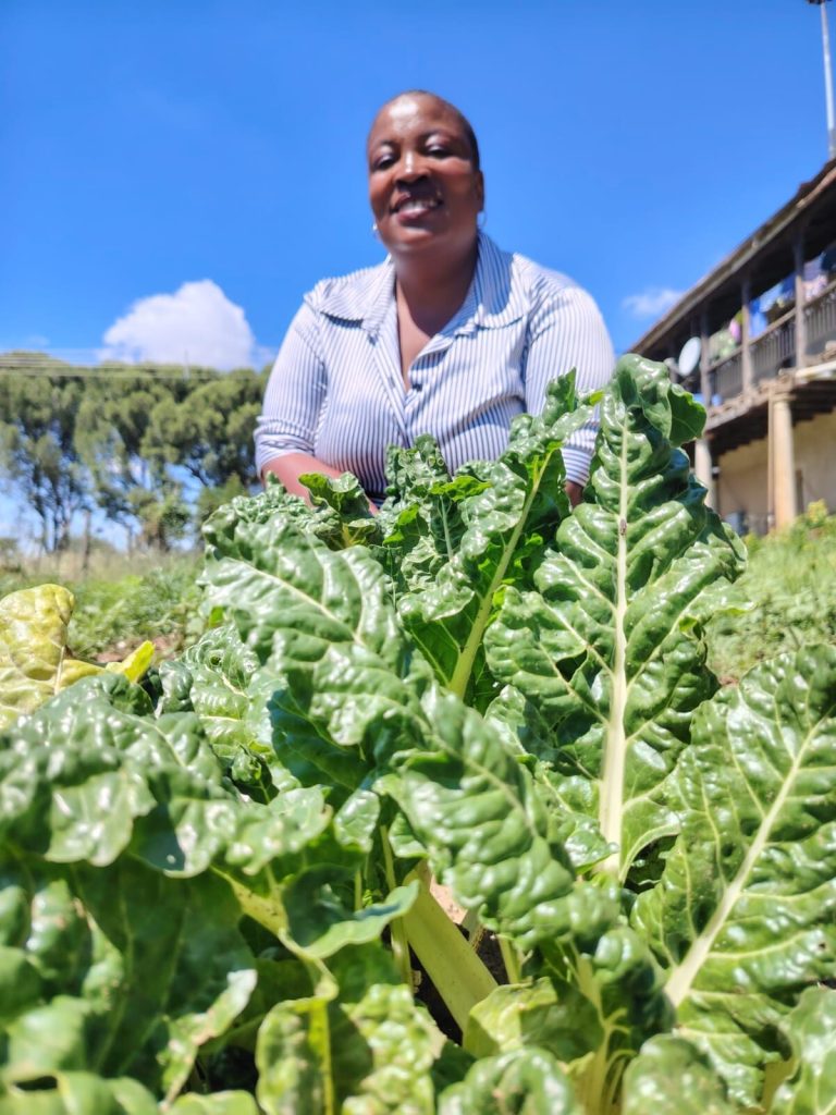 Woman in vegetable garden.