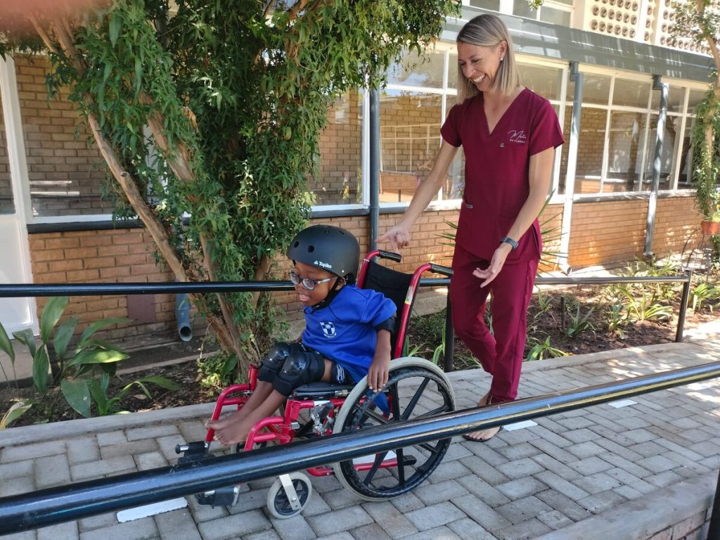 Morero Mogane (Gr. 1) and Magda Wessels on the new wheelchair course at the Martie du Plessis School. 