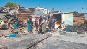 Grieving family seeks assistance following shack fire which claimed the lives of three of its children