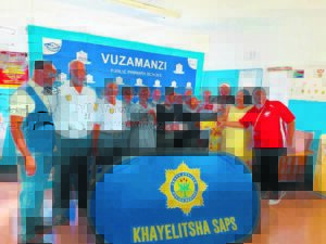 Khayelitsha Police donate shoes to pupils at Vuzamanzi Primary School, in Site C