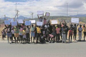 Children hold silent march to raise awareness about violence towards women and children