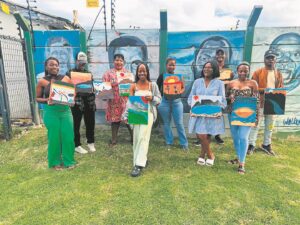 Lwandle residents learn new skill at Sip and Paint event