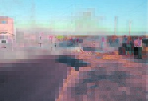 Street dark . . .except for fires