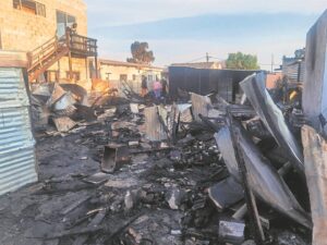 Two dead, seven homeless after shack blaze