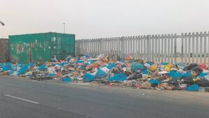 Rubbish piling up along Mew Way Road