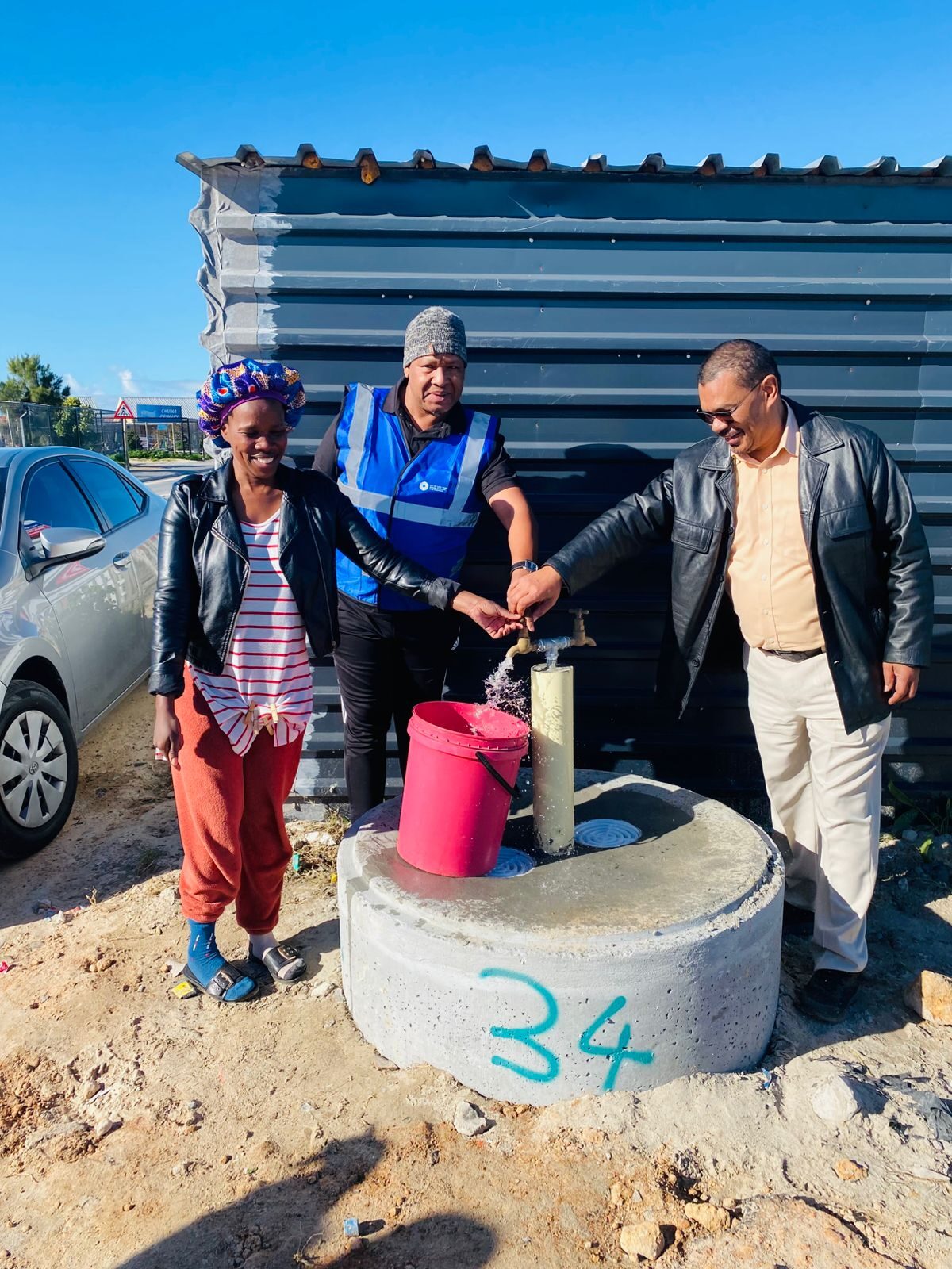 Level Two residents celebrate first communal taps installation