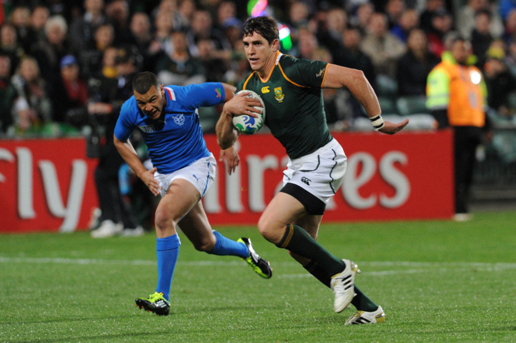 Oud-Bok Jaque Fourie hardloop met die bal tydens die Rugbywêreldbeker in 2011.