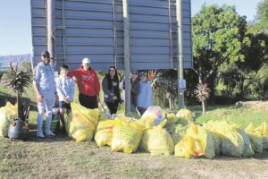 Locals roll up their sleeves to clean river