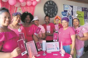 Women in blue swop uniforms for pink to raise awareness