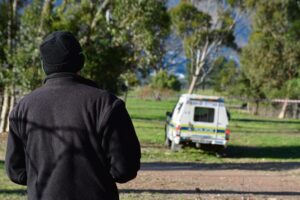 Man found hanging from tree in open field