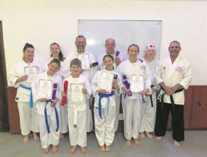 Karateka graded to next belt colour