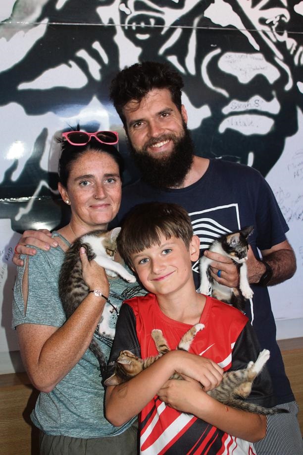 Cara, Charl and Logan Erasmus with their feline fr