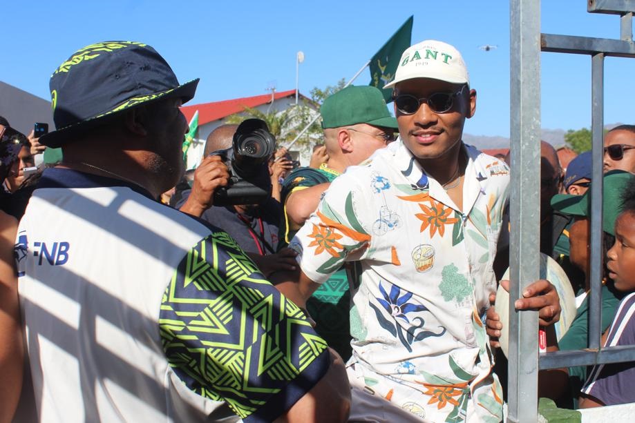 The local hero is greeted by local traffic officer