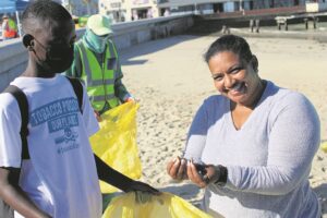 Learners roll up their sleeves for smokin’ cleanup!