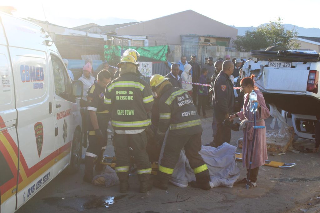 One of the suspects was treated at the scene before being taken to hospital under police guard. 
Photos: Yaseen Gaffar