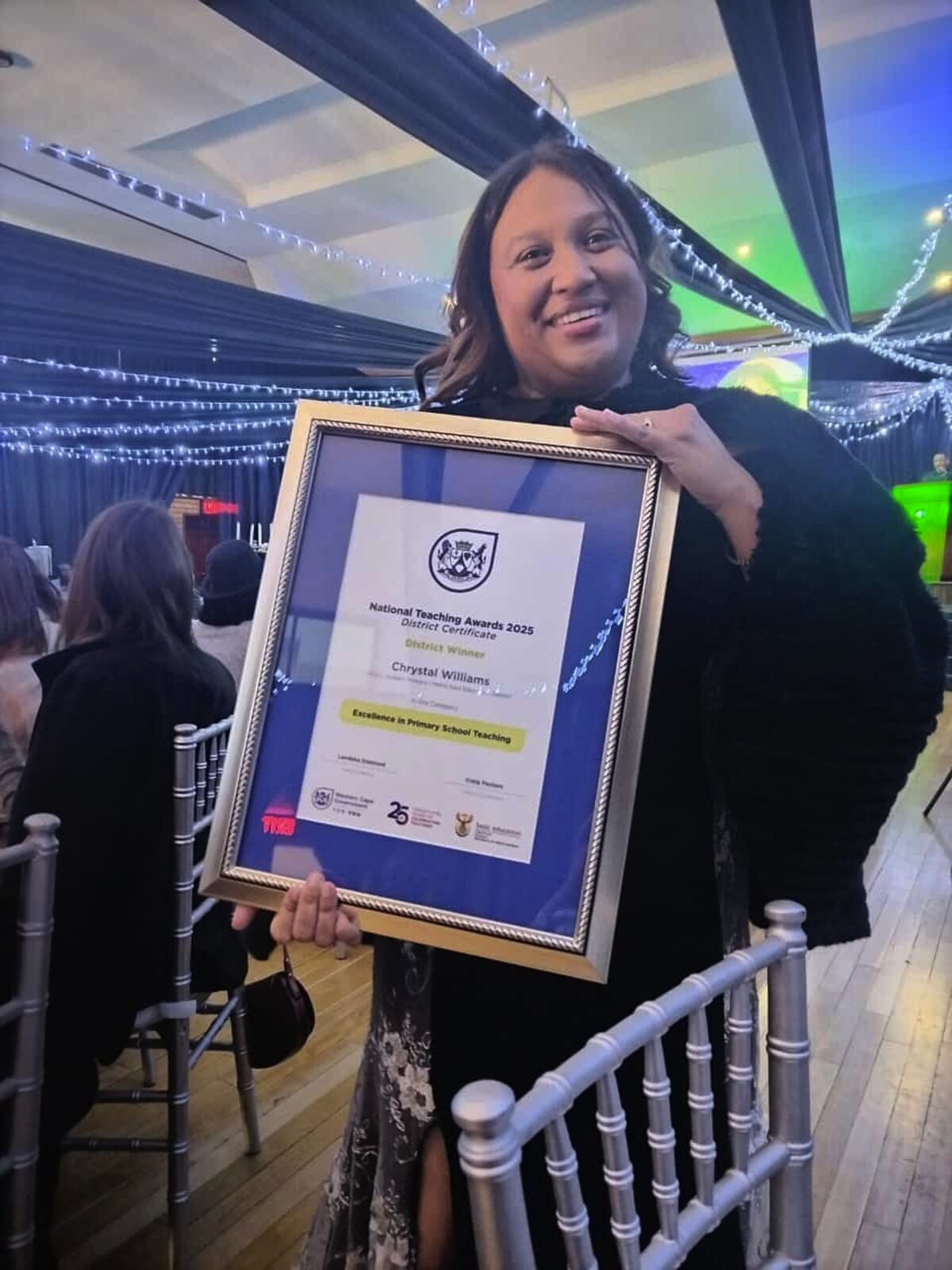 Chrystal Williams from Dr GJ Joubert Primary with her Excellence in Primary School Teaching award certificate