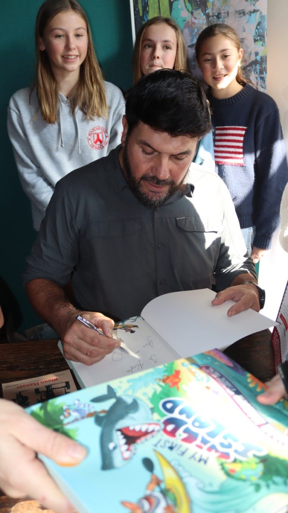 Riaan Manser and Murray Williams signing copies of their adventure books for young fans at Lourensford.
