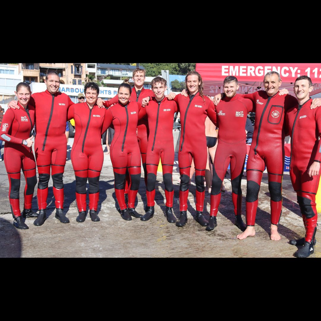 NSRI Station 9 crew members posing for a group photo at the Gordon's Bay Winter Solstice Swim fundraising event.