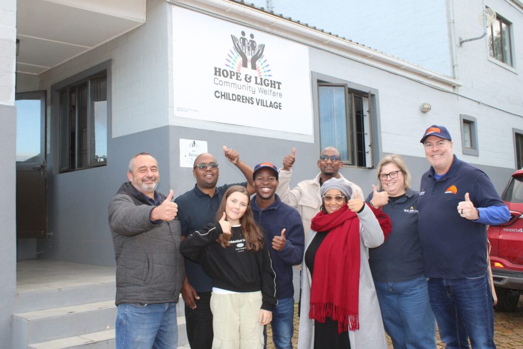 Mandela Day volunteers from Unashamedly Ethical interact with children at Hope & Light Village Sir Lowry's Pass