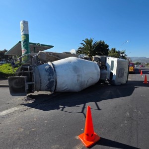Traffic delayed as concrete mixer truck overturns on Main Road
