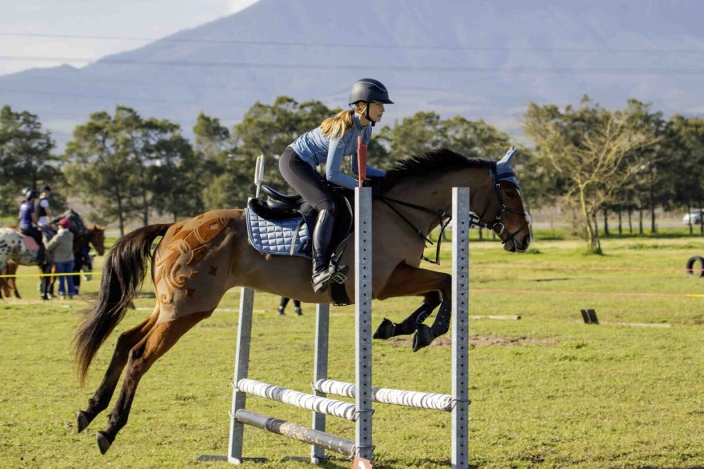 Young equestrian talent Chloe Holtrop and her agile horse, Rocket, soar over an obstacle with grace and precision. She will be in action at the upcoming show hosted by Helderberg Pony Club.