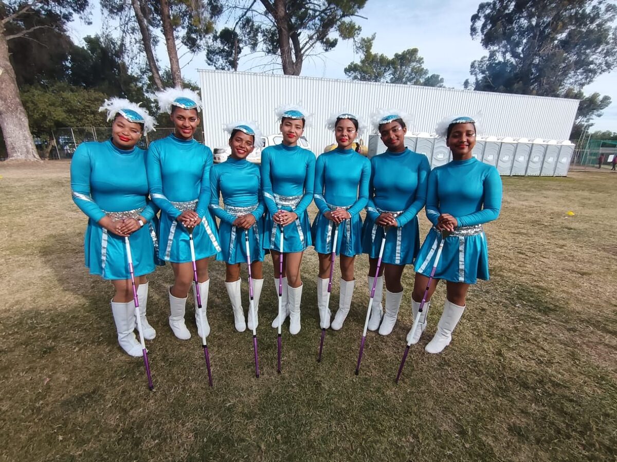 Seven HHH majorettes pose together holding maces after earning third place at 2025 Samca nationals.