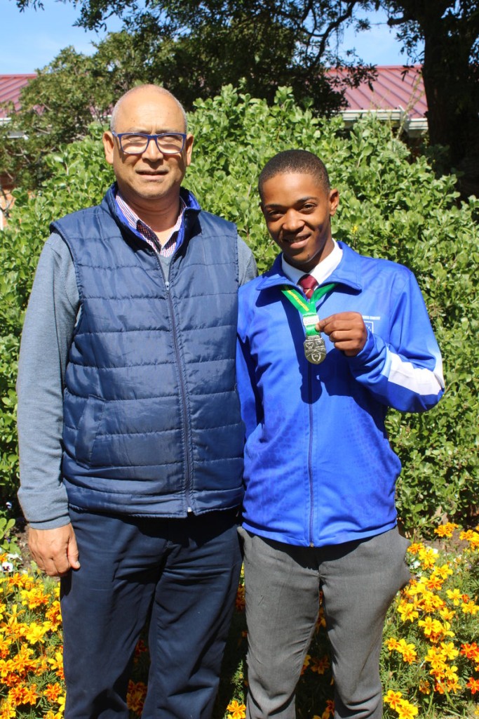 Duwayne van Rooyen with the school's athletics coordinator, Ghalib Africa.