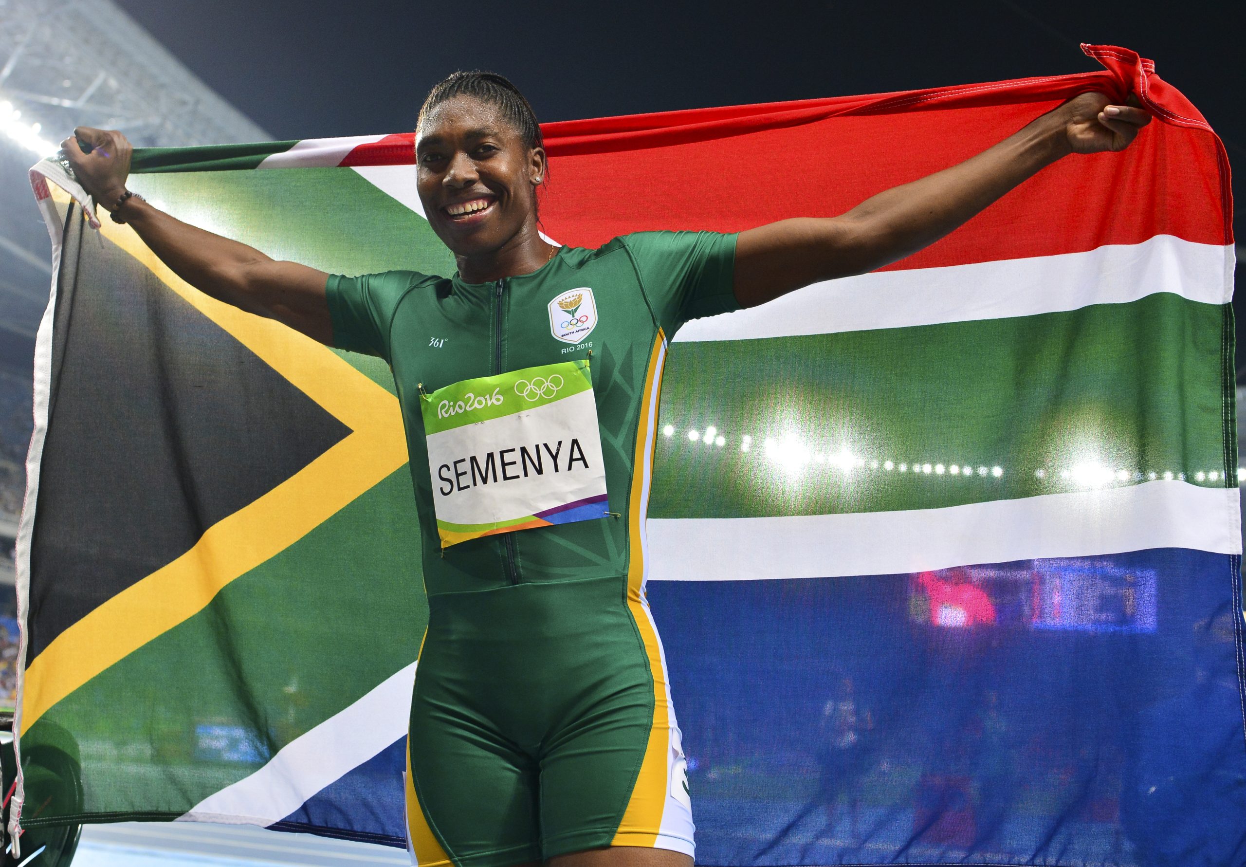 A jubilant Caster Semenya holds up the South African flag and celebrates her win in the women's 800 m final of the Rio 2016 Olympic Games. Photo: Roger Sedres/Gallo Images
