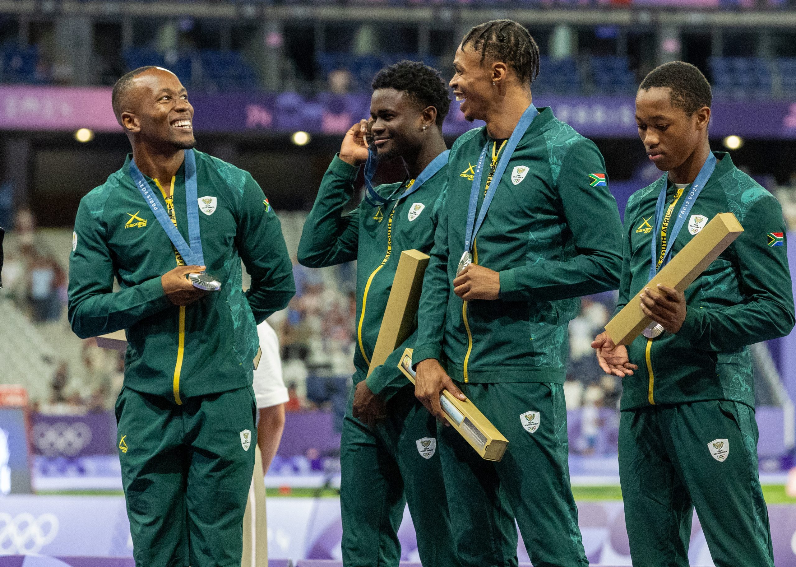Team South Africa's 100 m men's relay team - Akani Simbine, Bradley Nkoana, Shaun Maswanganyi and Bayanda Walaza - during the medal ceremony of the Olympic Games at Stade de France in Paris in August 2024. The South Africans won silver in the epic race. Photo: Roger Sedres/TeamSA
