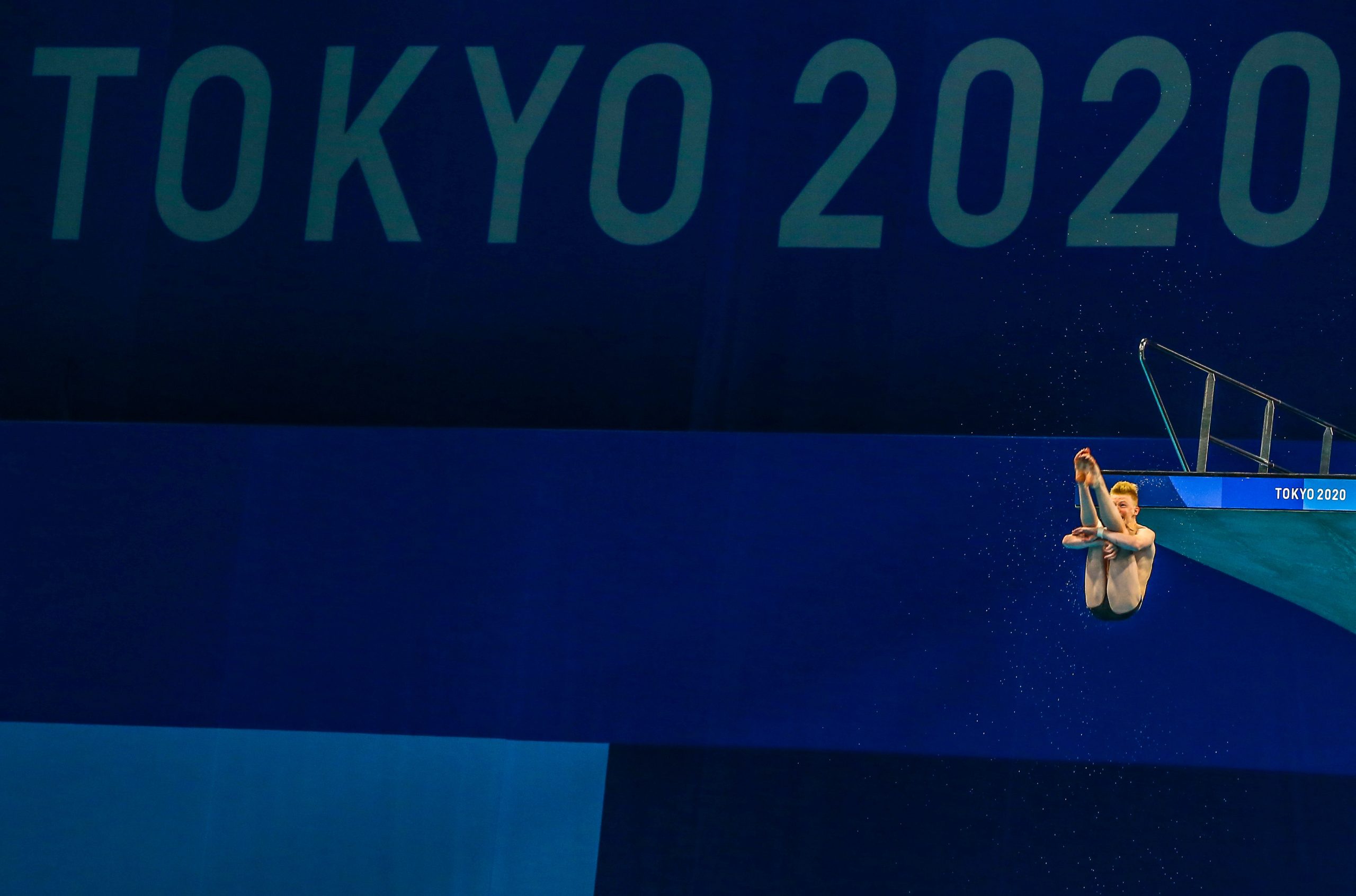 A diver practices his routine from the diving platform on Day 4 of the Tokyo 2020 Olympic Games at the Tokyo Aquatics Centre. Photo: Roger Sedres/Gallo Images