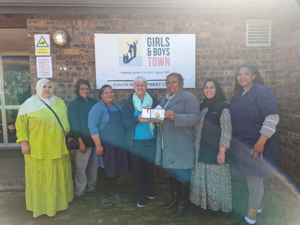 ROTO members presenting appreciation gifts to GBTSA Macassar staff during community outreach visit