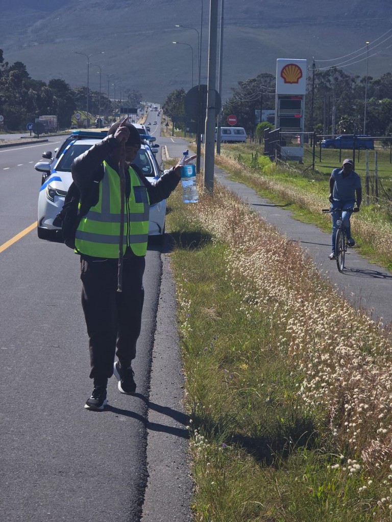Zondani greeting a local resident while walking on the N2 highway