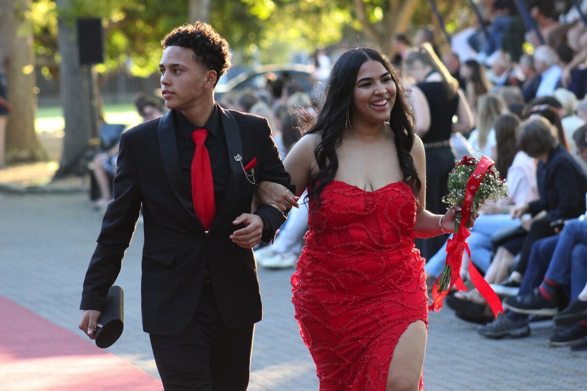 Jessy Jooste in scarlet gown with partner Keagan Haupt at Rhenish Girls' High School matric dance.