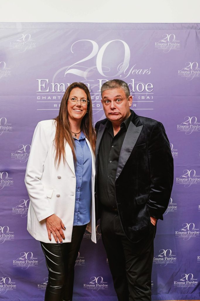 Emma Pardoe with comedian Alan Committie, who entertained guests at the firm's 20th anniversary celebration.