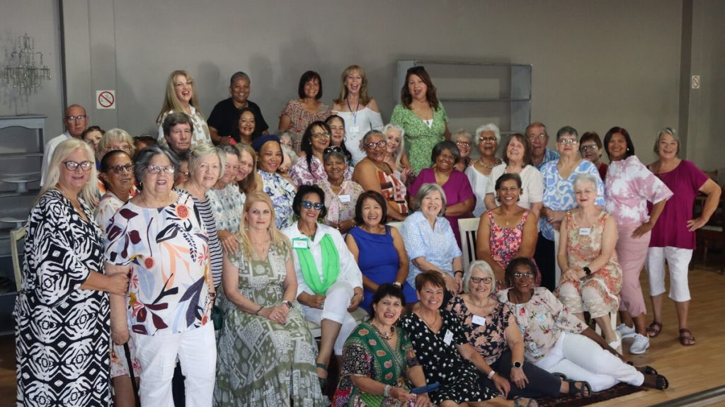 Members of Older Wiser Lovelier Seniors group photo at Smiling Oven restaurant in Strand.