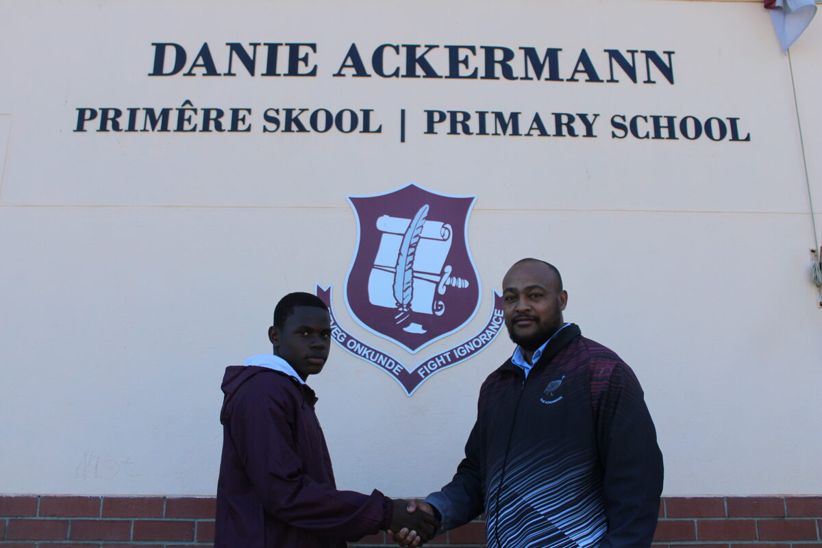 Dedication to rugby and hard work have earned Glofan Bokabile, a Grade 6 learner at Danie Ackermann Primary, a place in the under-12 Western Province team that will participate in the Interprovincial Tournament in Riversdale from Thursday 2 to Saturday 4 October. The 12-year-old, who plays left wing, enjoyed learning the game at school. He was selected during trials and made the school proud on his selection. Glofan is pictured with his school's sports coordinator, Ettienne Koert. Photo: Yaseen Gaffar