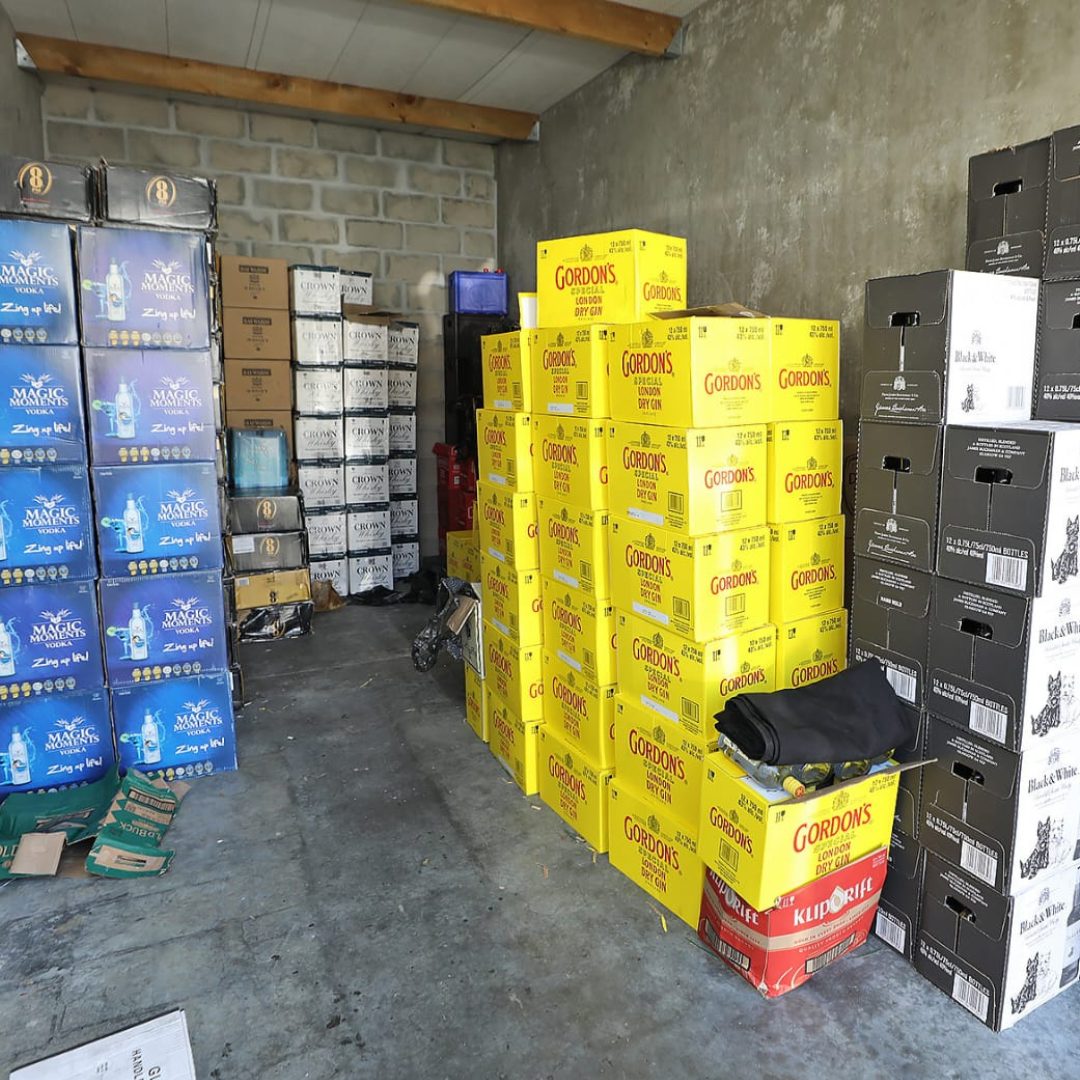 Multiple boxes of counterfeit bottles confiscated from Woodstock storage facility during raid