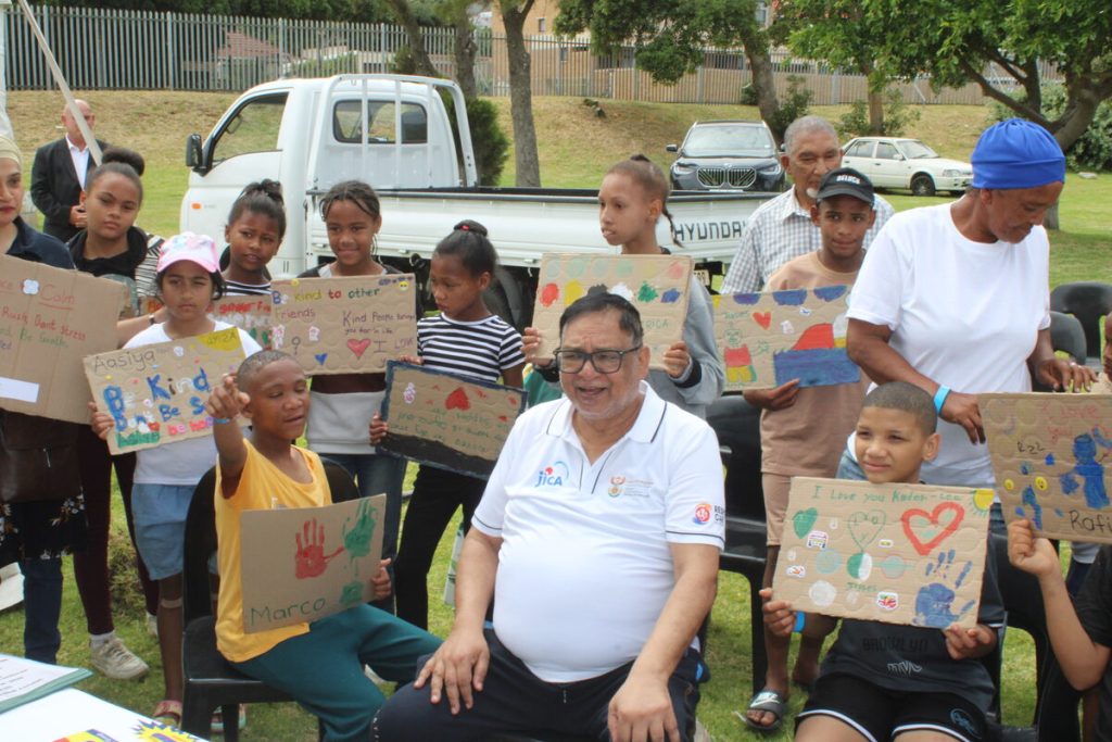 Deputy minister of Social Development Ganief Hendricks with some of the children at the youth summit.