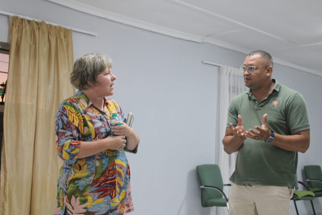 Melanie Smit of Helderberg Uitreik engages with Croydon HOA chairperson Lincoln Meyer during a recent community meeting in Croydon. 
