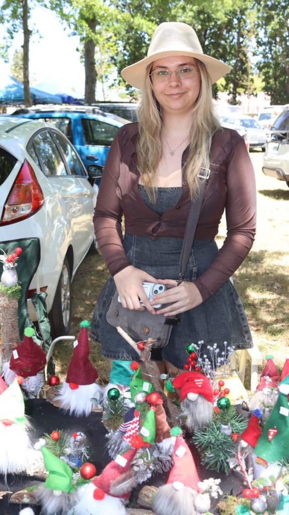 Kerry-Lee Christensen from Gnomy Christmas displays whimsical gnome creations at her market stall.