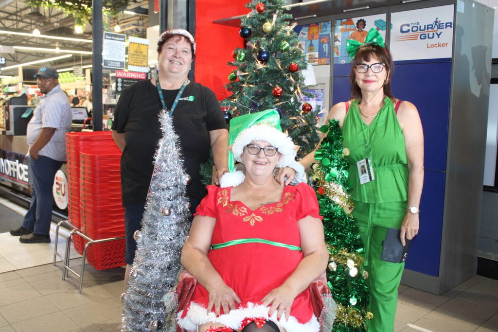 Linda Lemon (centre) was Santa for the day, flanked by Helene Wilson (left) and Sandra Walters- Lewis. 
Photos: Yaseen Gaffar