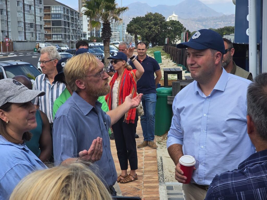 Mayor Geordin Hill-Lewis (right) engages Ward 83 councillor Carl Punt during a visit to Strand last week, where he also took a plunge into Strand Beach. Photo: Barend Williams