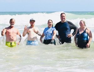 Bigwigs brave the wave in Strand