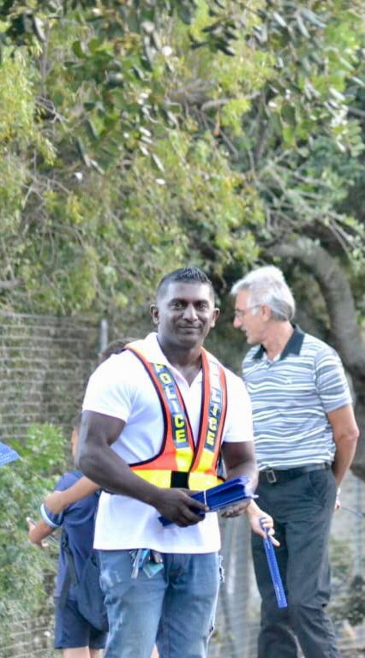 Sgt Jeremiah Naidoo holds rulers during his farewell anti-bullying campaign event